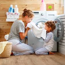 Mother and child doing laundry